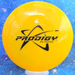 Load image into Gallery viewer, Top-down view of a pre-owned yellow Prodigy F1 prototype pre-flight numbers fairway driver disc golf disc in 400 plastic scaled at 173g in brand new 10 out of 10 uninked condition.
