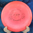 Load image into Gallery viewer, Top-down view of a pre-owned pink Prodigy FX-2 Disc of the Year edition fairway driver disc golf disc in 500 plastic scaled at 174g in 8 out of 10 inked condition.
