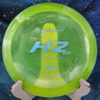 Load image into Gallery viewer, Top-down view of a pre-owned neon yellow Prodigy H2v2 hybrid distance driver disc golf disc in 750 plastic scaled at 172g in 8.5 out of 10 inked condition.
