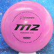 Load image into Gallery viewer, Top-down view of a pre-owned pink Prodigy M2 overstable midrange disc golf disc in 400G plastic scaled at 179g in 8 out of 10 inked condition.
