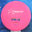 Load image into Gallery viewer, Top-down view of a pre-owned neon pink Prodigy PA-3 putt and approach disc golf disc in 300 Firm plastic scaled at 174g in 8 out of 10 uninked condition.
