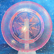 Load image into Gallery viewer, Top-down view of a translucent pink pre-owned Discraft Luna putt and approach disc golf disc in Battle Pack Z Confetti plastic with a multi-color foil Luna Battle Pack stamp.
