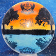 Load image into Gallery viewer, Top-down view of a pre-owned Truly Unique Chill At The Hill tournament stamped Dynamic Discs Criminal fairway driver disc golf disc in Fuzion DyeMax plastic scaled at 173g in 10 out of 10 uninked condition.
