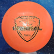 Load image into Gallery viewer, Top-down view of a pre-owned orange Dynamic Discs Criminal fairway driver disc golf disc in Fuzion plastic with camo foil stamp scaled at 174g in 10 out of 10 uninked condition.
