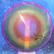 Load image into Gallery viewer, Top-down view of a pre-owned rainbow dyed custom stamp Dynamic Discs Deputy putter disc golf disc in Lucid plastic scaled at 172g in 10 out of 10 uninked condition.
