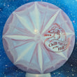 Load image into Gallery viewer, Top-down view of a pre-owned red and blue 2019 Chill At The Hill Dynamic Discs Judge putter disc golf disc in Classic Burst plastic scaled at 175g in 10 out of 10 uninked condition.
