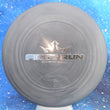 Load image into Gallery viewer, Top-down view of a pre-owned black and grey swirl digital weight First Run bar stamped Dynamic Discs Judge putter disc golf disc in Classic Blend plastic scaled at 176g in 10 out of 10 uninked condition.

