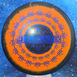 Load image into Gallery viewer, Top-down view of a pre-owned black and orange Raptor Eye Dynamic Discs Judge putter disc golf disc in Classic Blend plastic scaled at 176g in 10 out of 10 uninked condition.
