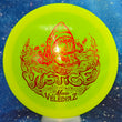 Load image into Gallery viewer, Top-down view of a pre-owned yellow special edition Shark Macie Velediaz Dynamic Discs Justice midrange disc golf disc in Fluid plastic scaled at 173g in 10 out of 10 uninked condition.
