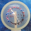 Load image into Gallery viewer, Top-down view of a pre-owned white limited edition 046 of 200 Ricky Wysocki Disc Or Die stamped Dynamic Discs Justice midrange disc golf disc in Lucid plastic scaled at 174g in 10 out of 10 uninked condition.
