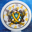 Load image into Gallery viewer, Top-down view of a pre-owned white Trilogy Man yellow bar stamped Dynamic Discs Justice midrange disc golf disc in Classic Blend plastic in 9.5 out of 10 uninked condition.
