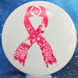 Load image into Gallery viewer, Top-down view of a pre-owned white 2017 Truly Unique Breast Cancer Awareness pink ribbon stamped Dynamic Discs Justice midrange disc golf disc in Fuzion DyeMax plastic scaled at 176g in 10 out of 10 uninked condition.
