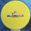 Load image into Gallery viewer, Top-down view of a pre-owned yellow 1 of 100 first run Dynamic Discs Slammer approach putter disc golf disc in Classic plastic with party time foil stamp scaled at 175g in 9.5 out of 10 uninked condition.
