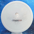 Load image into Gallery viewer, Top-down view of a pre-owned white Dynamic Discs SockiBomb Slammer overstable approach disc in Prototype Classic plastic with silver stamp scaled at 175g in 10 out of 10 uninked condition.
