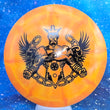 Load image into Gallery viewer, Top-down view of a pre-owned orange Halloween Zombie Trilogy Man stamped Dynamic Discs Trespass distance driver disc golf disc in Fuzion Burst plastic scaled at 169g in 10 out of 10 uninked condition.
