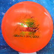 Load image into Gallery viewer, Top-down view of a pre-owned orange Latitude 64 Compass midrange disc golf disc in Opto plastic featuring a black foil Gravity tree roots logo stamp scaled at 179g in 8 out of 10 uninked condition.

