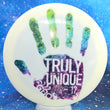 Load image into Gallery viewer, Top-down view of a pre-owned white 2017 Glass Blown Open Truly Unique Latitude 64 Gladiator distance driver disc golf disc in Gold Line plastic scaled at 174g in 10 out of 10 uninked bag kept condition.
