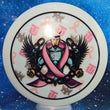 Load image into Gallery viewer, Top-down view of a pre-owned white Breast Cancer Awareness Trilogy Man custom printed Westside Discs Catapult distance driver disc golf disc in DyeMax Tournament plastic with matching mini scaled at 169g in 10 out of 10 uninked condition.
