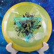 Load image into Gallery viewer, Top-down view of a yellow and green swirled Prodigy D6 distance driver disc golf disc in Reblend plastic with a teal holographic and black two-foil Throwing Astro stamp.
