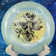 Load image into Gallery viewer, Top-down view of a brand-new teal and yellow swirled Prodigy F9 fairway driver disc golf disc in 400 Spectrum plastic with a Throwing Astro special edition 2-foil stamp.
