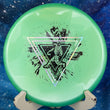 Load image into Gallery viewer, Top-down view of a green Prodigy P Model OS putt and approach disc golf disc in 500 plastic featuring a silver money, green shimmer, and black foil Neon Astro stamp.
