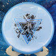 Load image into Gallery viewer, Top-down view of a light blue Prodigy P Model OS putt and approach disc golf disc in 500 plastic featuring a blue shimmer and black foil Neon Astro stamp.

