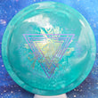 Load image into Gallery viewer, Top-down view of a brand new true teal swirl Prodigy Special Edition Throwing Astro Feedback fairway driver disc golf disc in 400 Spectrum plastic featuring a purple and olive shatter foil stamp.
