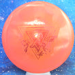 Load image into Gallery viewer, Top-down view of a brand new metallic orange and pink Prodigy Special Edition Throwing Astro M4 midrange disc golf disc in 500 plastic featuring a pink and orange holographic foil stamp.

