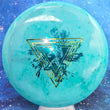 Load image into Gallery viewer, Top-down view of a brand new teal fractal Prodigy Special Edition Throwing Astro MX-3 midrange disc golf disc in 400 Fractal plastic featuring a green camo and blue holographic foil stamp.
