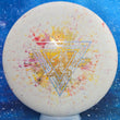 Load image into Gallery viewer, Top-down view of a brand new white, yellow, and red fractal Prodigy Special Edition Throwing Astro PA-3 putter disc golf disc in Fractal 300 Glow plastic featuring a silver circles and gold shatter foil stamp.
