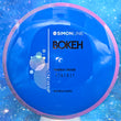 Load image into Gallery viewer, New Axiom Bokeh Midrange Driver in Neutron Plastic - Simon Line Special Edition with Pink-Blue Swirl Rim and Blue Core.
