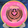 Load image into Gallery viewer, Top view of a Neon Pink Axiom Bokeh Simon Lizotte Team Series fairway driver in Neutron plastic with a Yellow Swirl GYRO rim, featuring a Gold, Brown, and Gold Holo tri-foil "Bokeh Latte" stamp, 174g, 10/10 condition.
