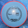 Load image into Gallery viewer, Axiom Envy in Electron Firm plastic featuring a Red Rim and Blue Flight Plate with Black specialty stamp - 169g.
