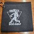 Load image into Gallery viewer, Black Gravity Disc Golf 16x16 Waffle Towel with Carabiner Clip.
