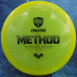 Load image into Gallery viewer, Neon Yellow Discmania Method in Neo plastic with a Pink Holo foil stamp.
