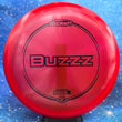 Load image into Gallery viewer, Red Discraft Buzzz in Z Line plastic with a Black Matte foil stamp.
