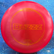 Load image into Gallery viewer, Red Discraft Buzzz in Z Line plastic with an Orange Sparkle foil stamp.
