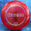 Load image into Gallery viewer, Red Discraft Buzzz in Z Line plastic with a Silver Prism foil stamp.
