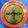 Load image into Gallery viewer, Orange Discraft Scorch in Z Line plastic with a Black Matte foil stamp.
