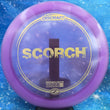 Load image into Gallery viewer, Purple Discraft Scorch in Z Line plastic with a Gold Glimmer foil stamp.
