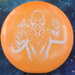 Load image into Gallery viewer, Orange Discraft Undertaker in Big Z plastic with a White Matte character stamp.
