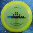 Load image into Gallery viewer, Neon Yellow Dynamic Discs Criminal in Lucid plastic with a Blue Holo foil stamp.
