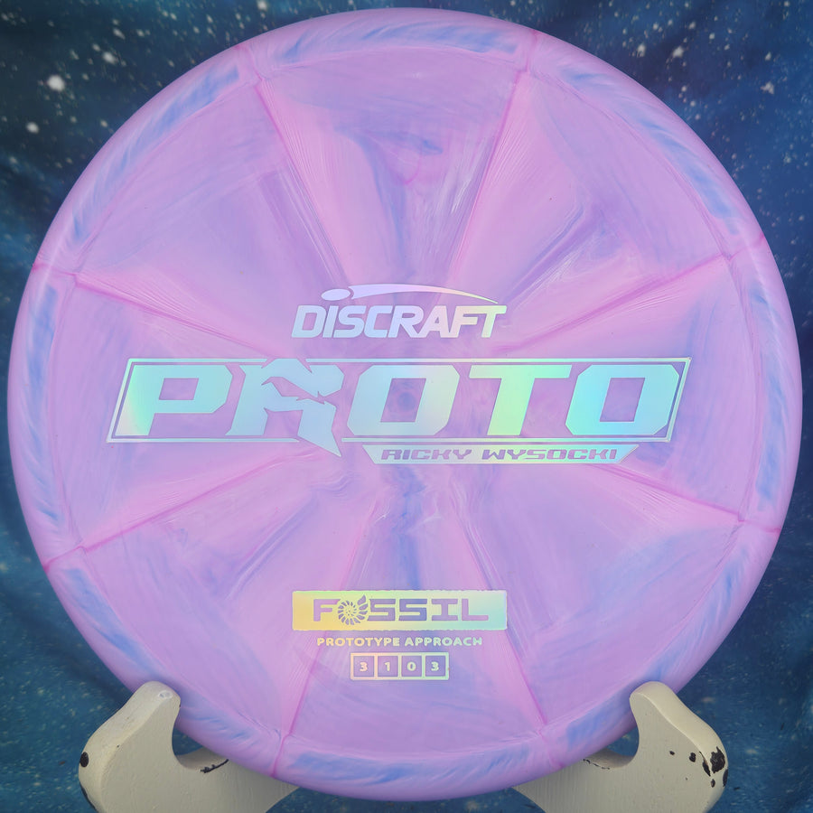 Pink and purple Discraft Proto Fossil disc golf disc