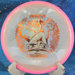 Load image into Gallery viewer, Top view of a Pink Proto Glow Halo Champion Innova Emily Weatherman Fox midrange featuring a glowing core and an Orange Holo tri-foil champion series stamp, 180g, 10/10 condition.
