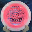 Load image into Gallery viewer, White and pink Halo Star Gorgon disc golf driver, 2026 Dennis Augustsson Champion Series tour stamp with blue holo foil.
