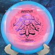 Load image into Gallery viewer, Blue and pink Halo Star Teebird disc golf driver, 2026 Joona Heinanen Champion Series tour stamp with purple holo foil.
