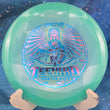 Load image into Gallery viewer, Top view of a Teal Proto Color Glow Champion Innova Jennifer Allen Teebird featuring a Pink and Blue Holo tri-foil tour stamp, 174g, 10/10 condition.
