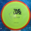Load image into Gallery viewer, Pre-Owned Orange Rim with Neon Yellow Axiom Discs Time Lapse from the Simon Line in Premium Neutron Plastic - 7.5/10 Condition, Uninked - 174g.
