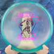 Load image into Gallery viewer, Top view of a Blue pre-owned Innova-made Discmania MD3 in C-Line plastic featuring a pink "Gravity Disc Golf" astronaut special edition stamp, rated 9.5/10 condition.
