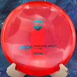 Load image into Gallery viewer, Top view of a Red pre-owned Discmania MD3 stable midrange disc in C-Line plastic, featuring a Blue "Discmania" shield stamp, rated 8.5/10 condition and marked as inked.

